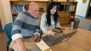 Writing Specialist tutoring a student in CAPS.